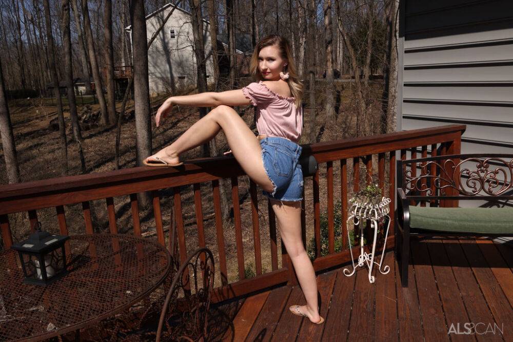 Young white girl Emma Sirus gets naked before pissing on a deck - #3