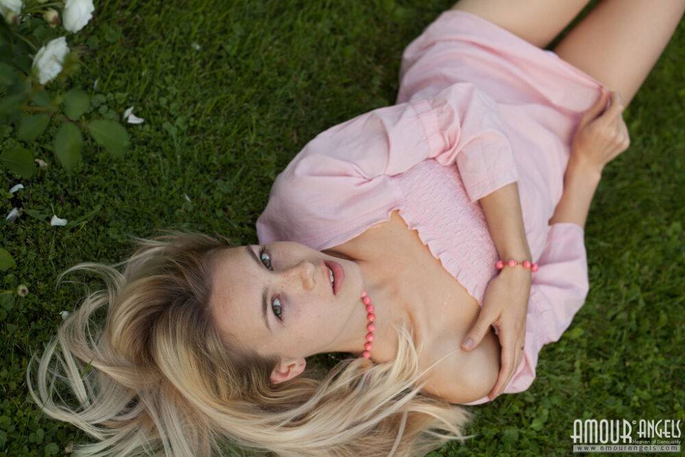 Dirty blonde Dolly touches her hairy teen pussy with a white rose on a lawn - #15