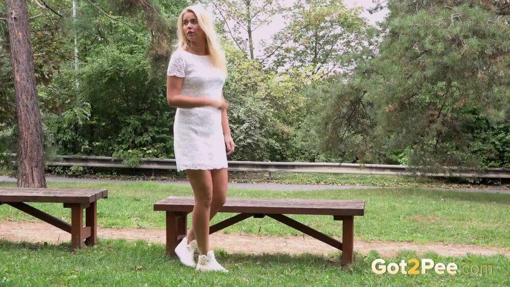 Beautiful blonde Nikki Dream in white lace dress pauses to pee in the park - #4