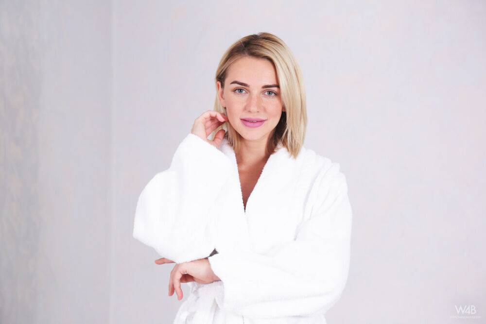 Blonde model Likka removes a white bathrobe before touching her naked body - #2