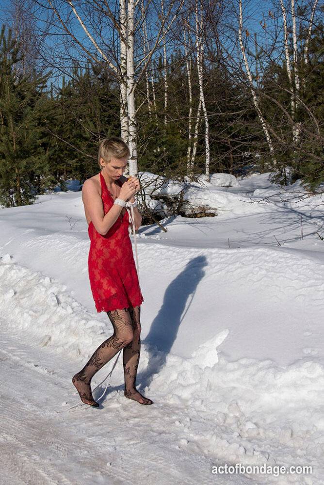 White female is toed up and forced to stand and kneel in snow - #12