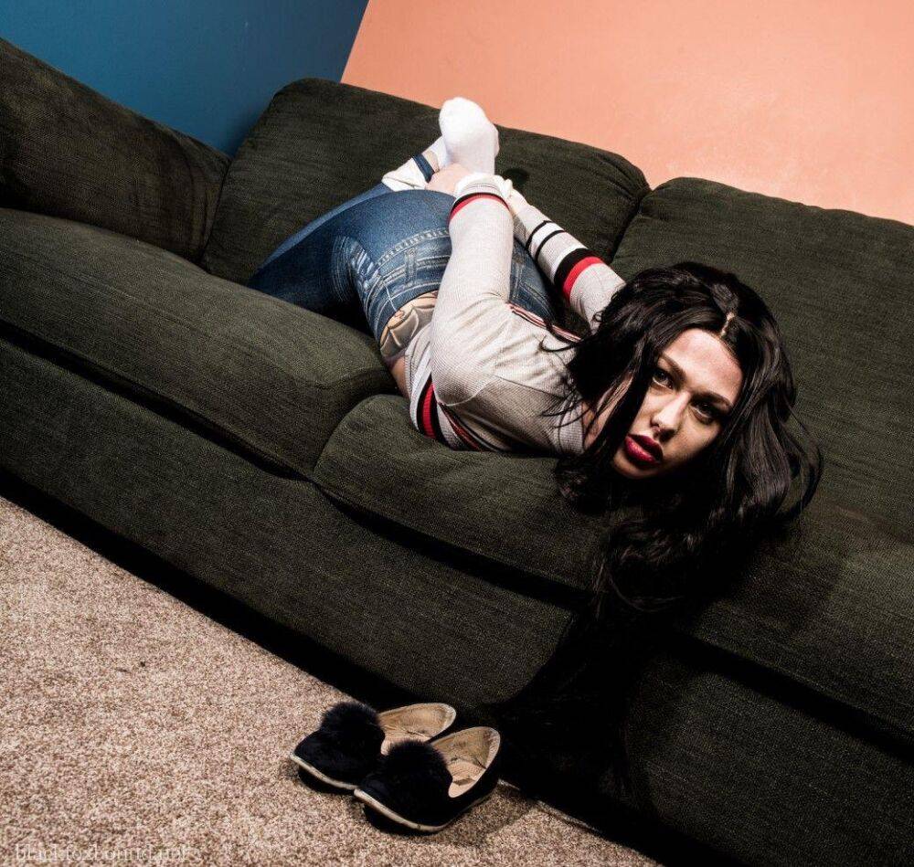 Dark haired chick is hogtied on a couch while closed in jeans and white socks - #5