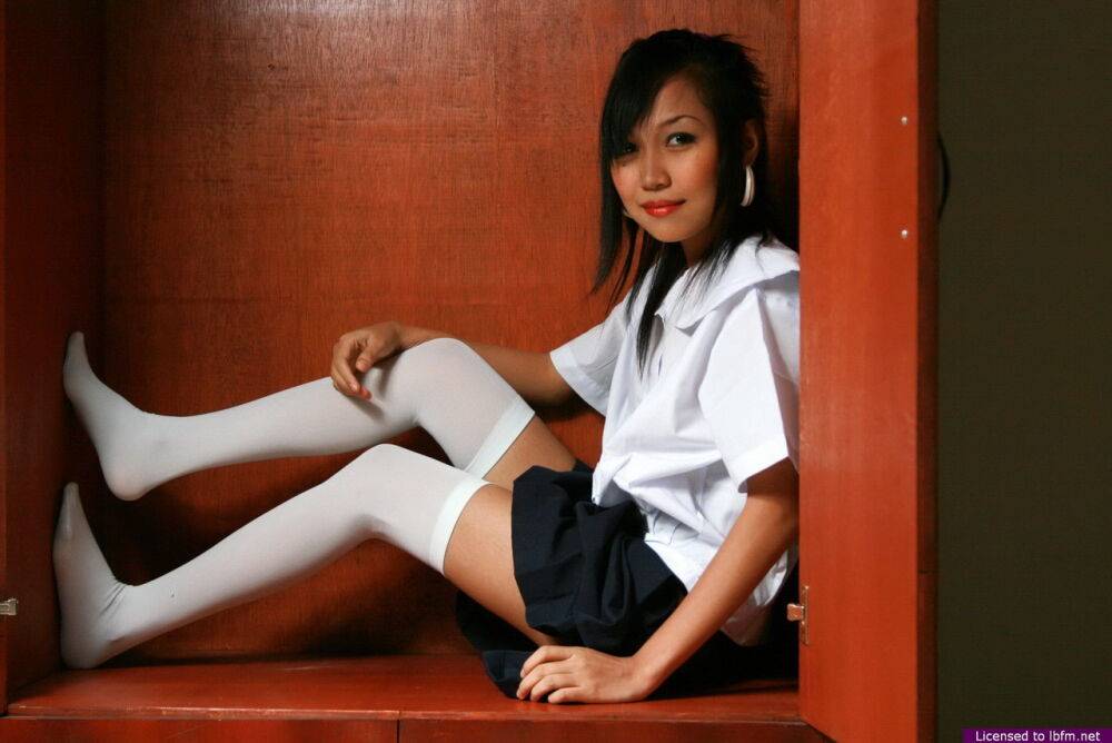 Cute Asian student showcases her bald cunt on a shelf in white OTK socks - #8