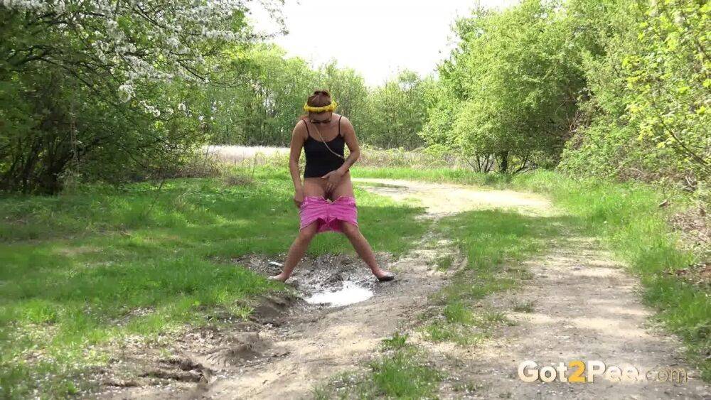 White girl Dafne pisses in a mud puddle while out for a walk in sunglasses - #5