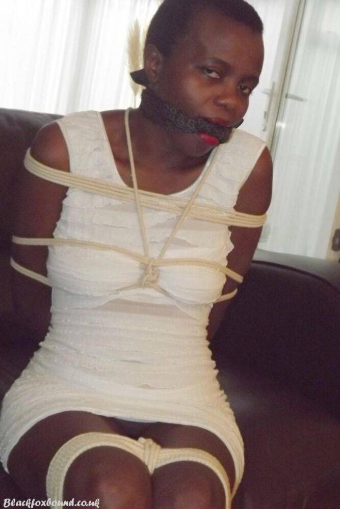 Black female is left tied and cleave gagged in a white dress on a leather sofa - #10