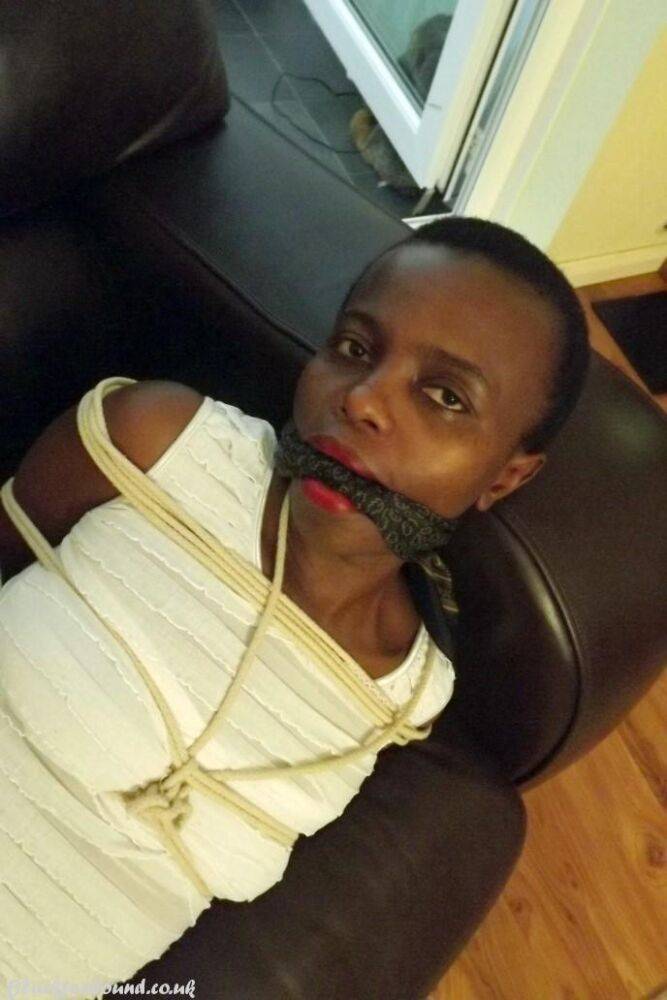 Black female is left tied and cleave gagged in a white dress on a leather sofa - #3