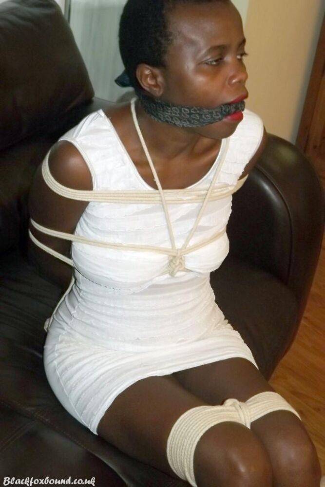 Black female is left tied and cleave gagged in a white dress on a leather sofa - #7