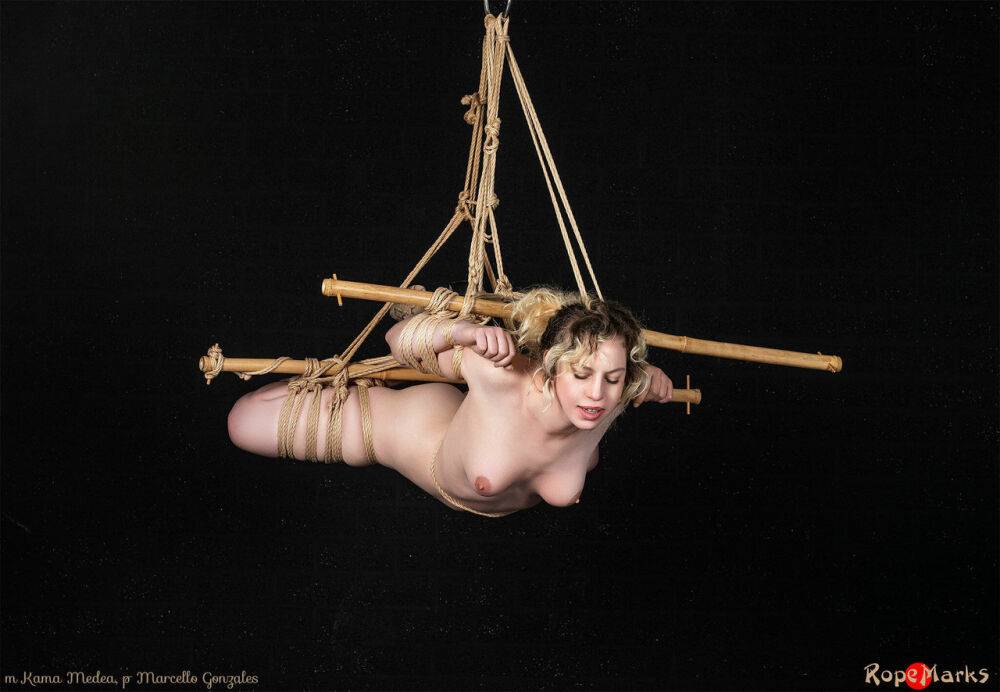 Naked white girl Kama Medea is suspended by ropes while anally hooked - #16