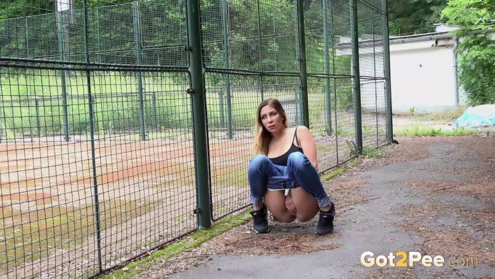 Sexy brunette Rebecca dropping jeans and white panties and pissing in public - #12