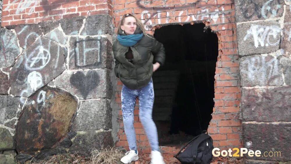 White girl pulls down her jeans for a badly needed pee on snow-covered ground - #10