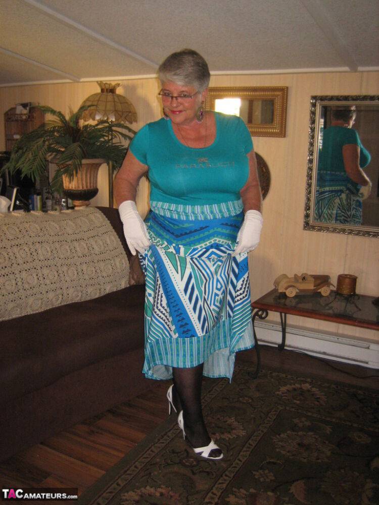 Fat Oma Girdle Goddess wears white gloves while disrobing to a bra and girdle - #5