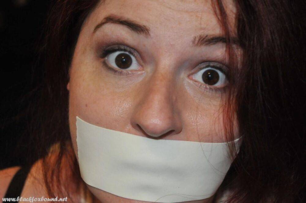 White girl is silenced with medical tape while tied up in her clothing - #4