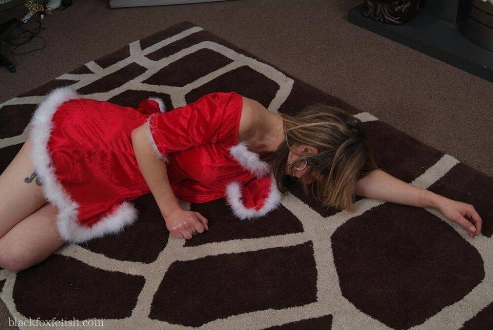 White girl is tied up and cleave gagged in Christmas clothing near the tree - #12