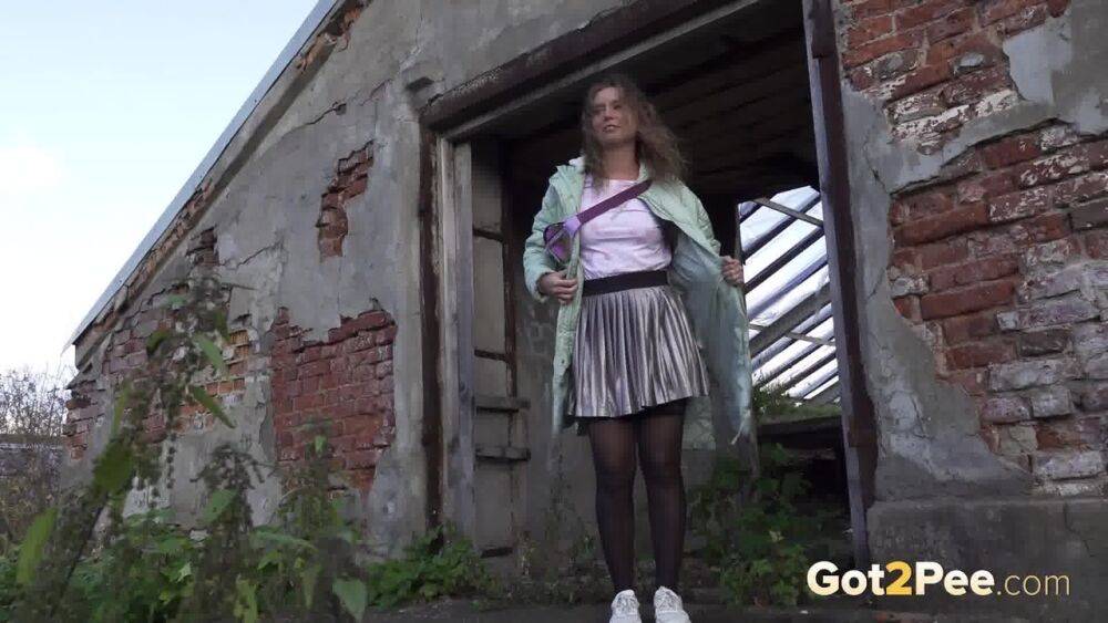 White girl Rita takes a piss by an abandoned building while taking a shortcut - #13