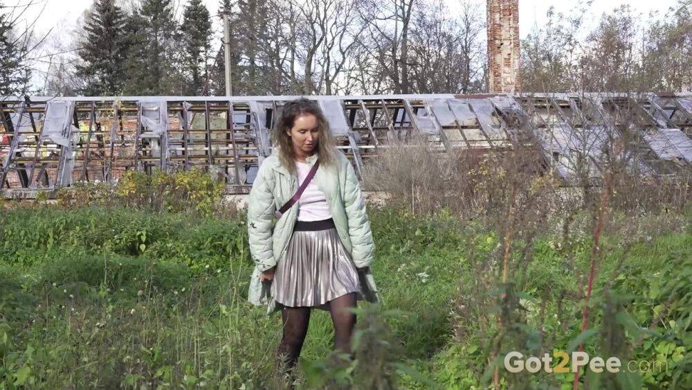 White girl Rita takes a piss by an abandoned building while taking a shortcut - #12