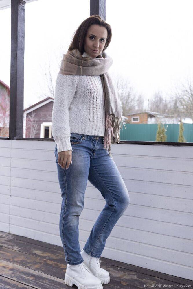 Kamilla is outside in the cold in her white sweater and denim jeans She enjoys - #2