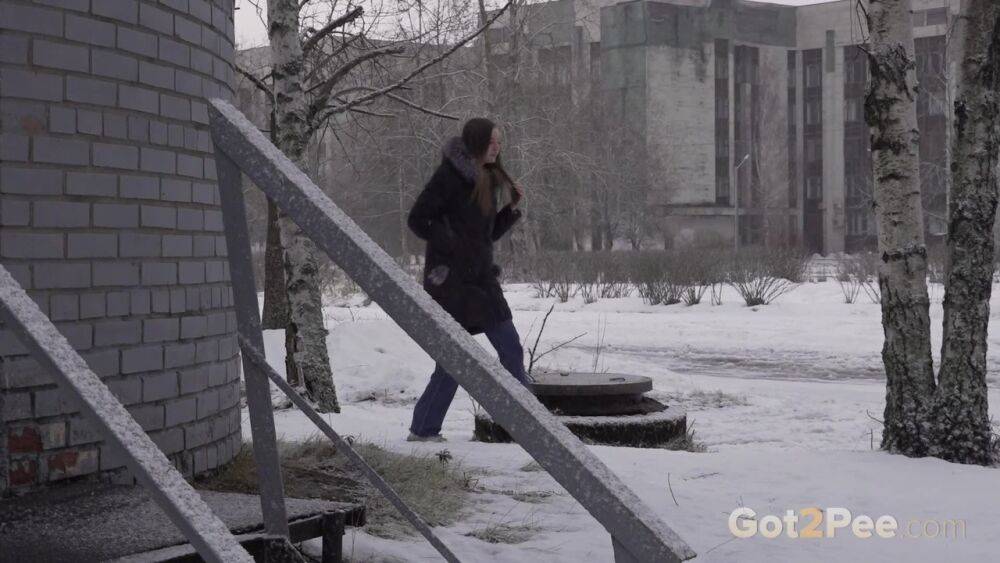 White girl pulls down her jeans to pee in the snow behind a building - #8