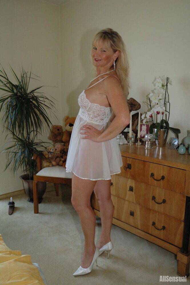 Busty blonde Marlen posing in a white negligee in the bedroomBig - #6