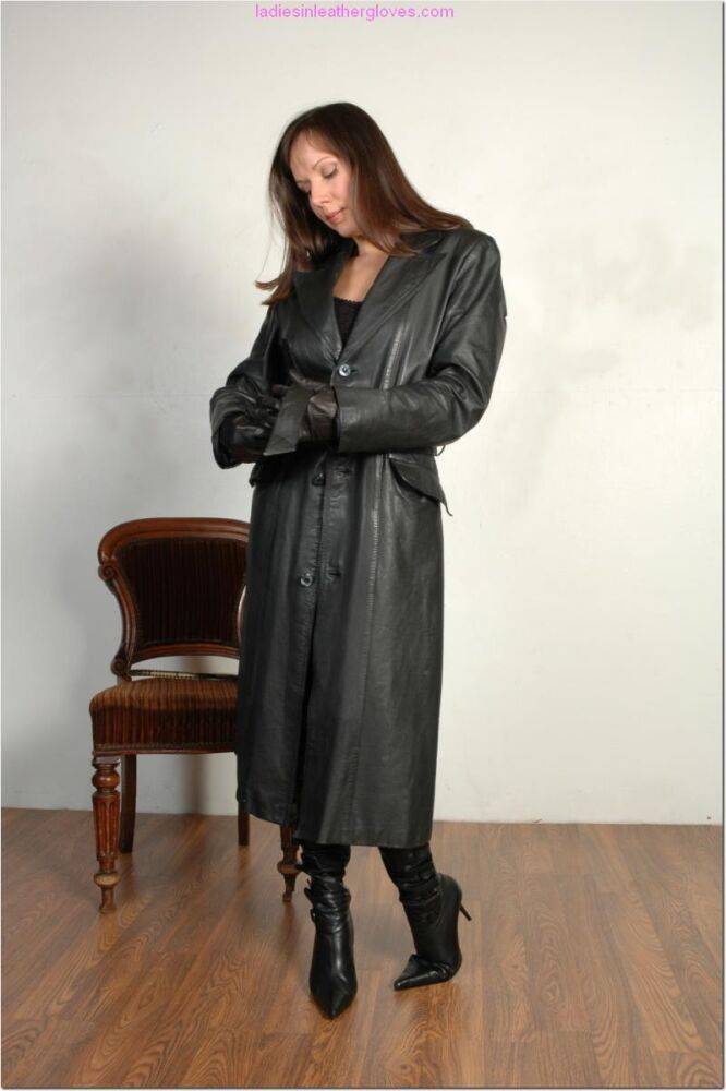 Brunette female dons long leather coat in leather boots and stockings - #5