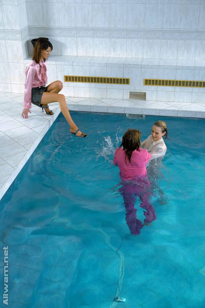 Fully clothed fetish ladies having some wet fun in the pool - #14