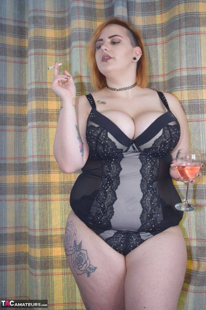 Tattooed BBW smokes and drinks while peeling off her lingerie - #8