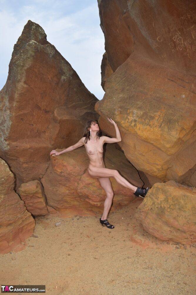 Amateur model gets naked in high-heeled footwear on iron ladened rocks - #2