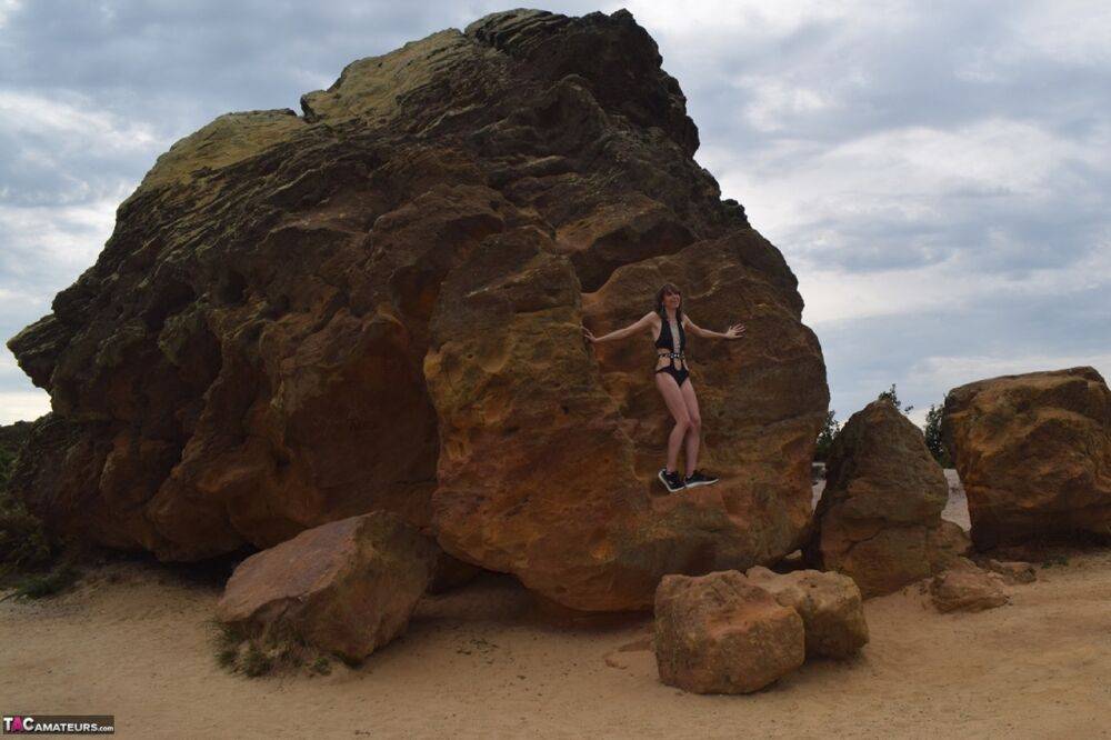 Amateur model gets naked in high-heeled footwear on iron ladened rocks - #14