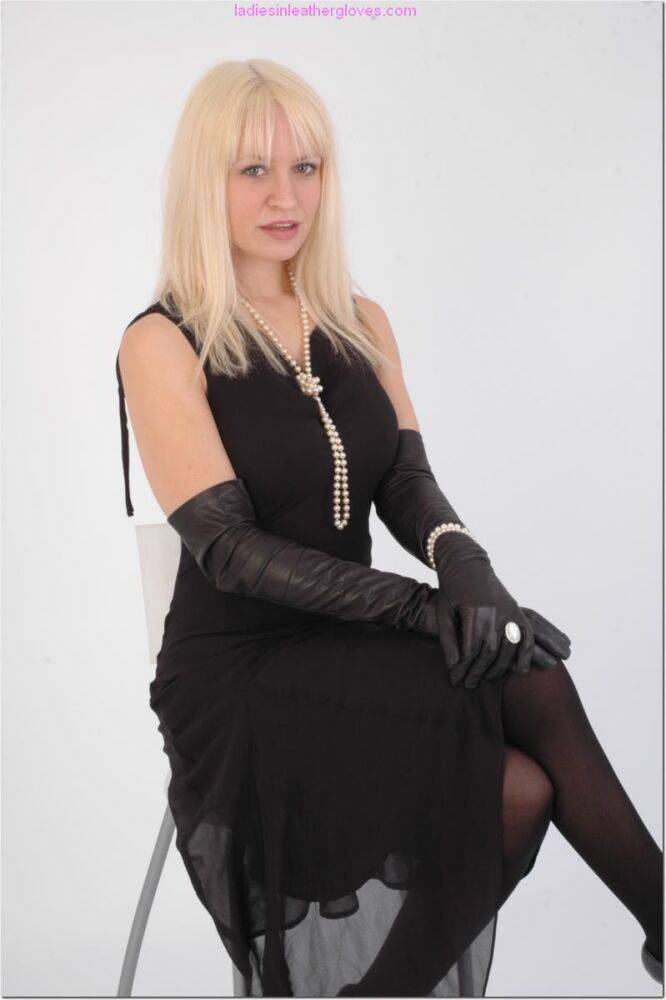 Natural blonde exposes some thigh while wearing long leather gloves - #3
