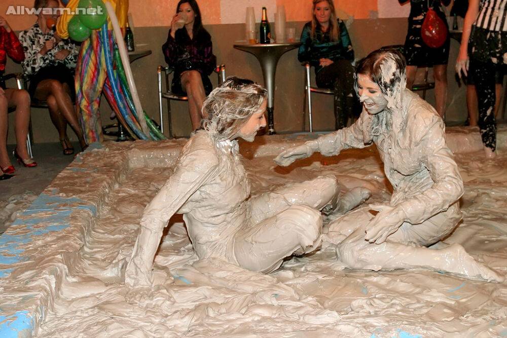 Seductive fetish ladies get involved in fully clothed mud wrestling - #4