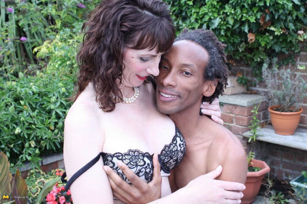 Cheating UK housewife seduces a black man in a black skirt on patio - #8