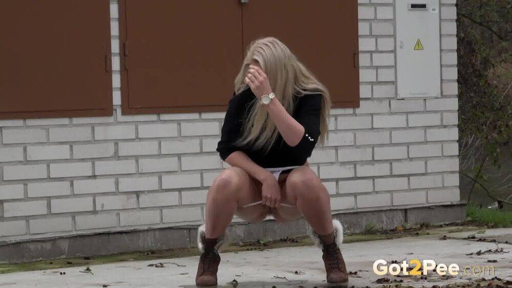 Stunning blonde squats to piss outside - #11