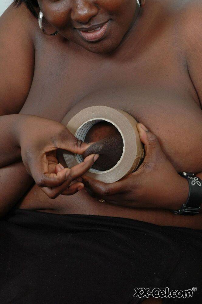 Afro-American BBW Mariana Kodjo wraps her huge tits in duct tape & poses nude - #13