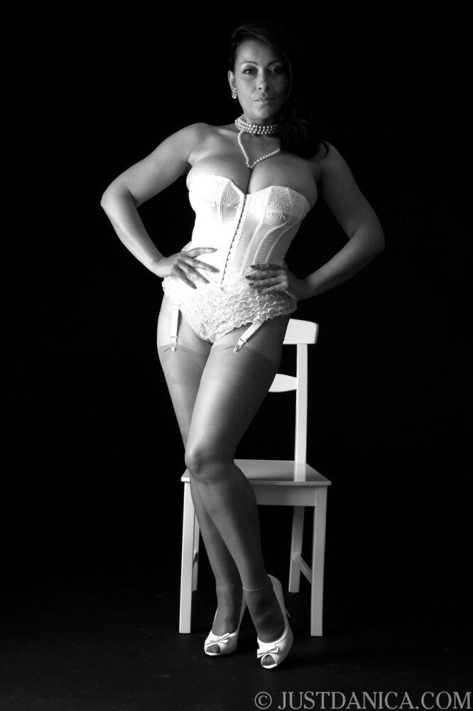 Glamorous cougar with big juggs Danica Collins poses in her corset & stockings | Photo: 3869160