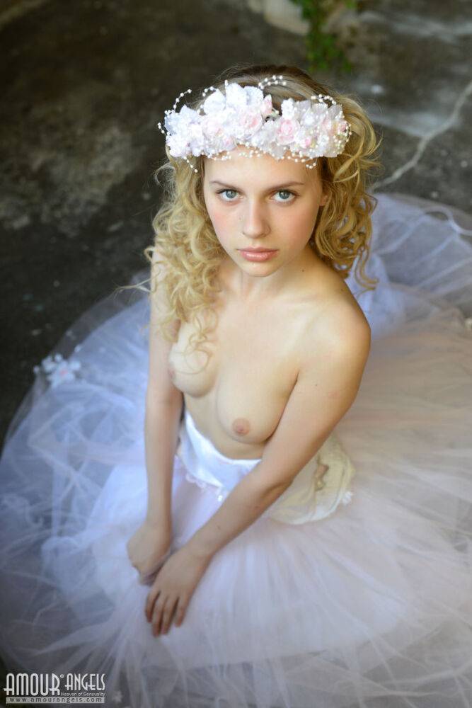 Blonde teen strips off her bridal gown and cotton panties for nude poses - #9