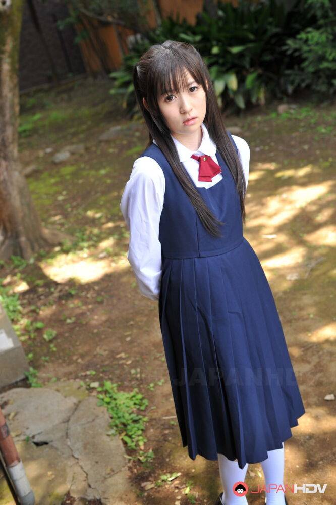 Charming Japanese babe posing in her cute school outfit in the garden - #9