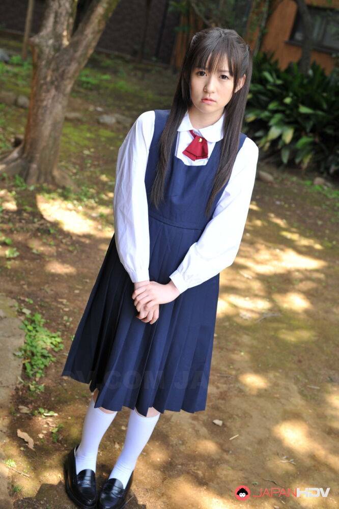 Charming Japanese babe posing in her cute school outfit in the garden - #7