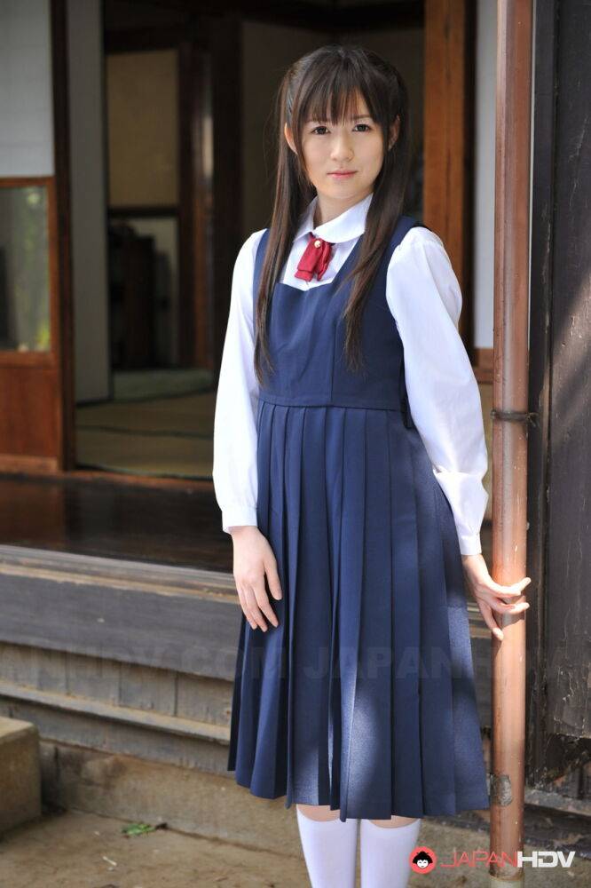 Charming Japanese babe posing in her cute school outfit in the garden - #2