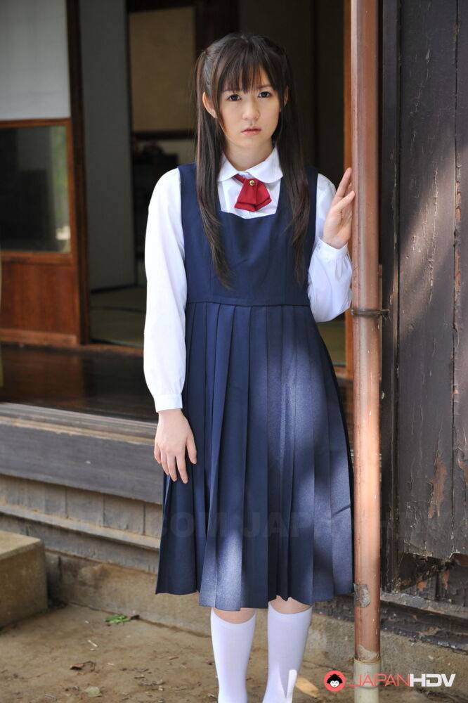 Charming Japanese babe posing in her cute school outfit in the garden - #1