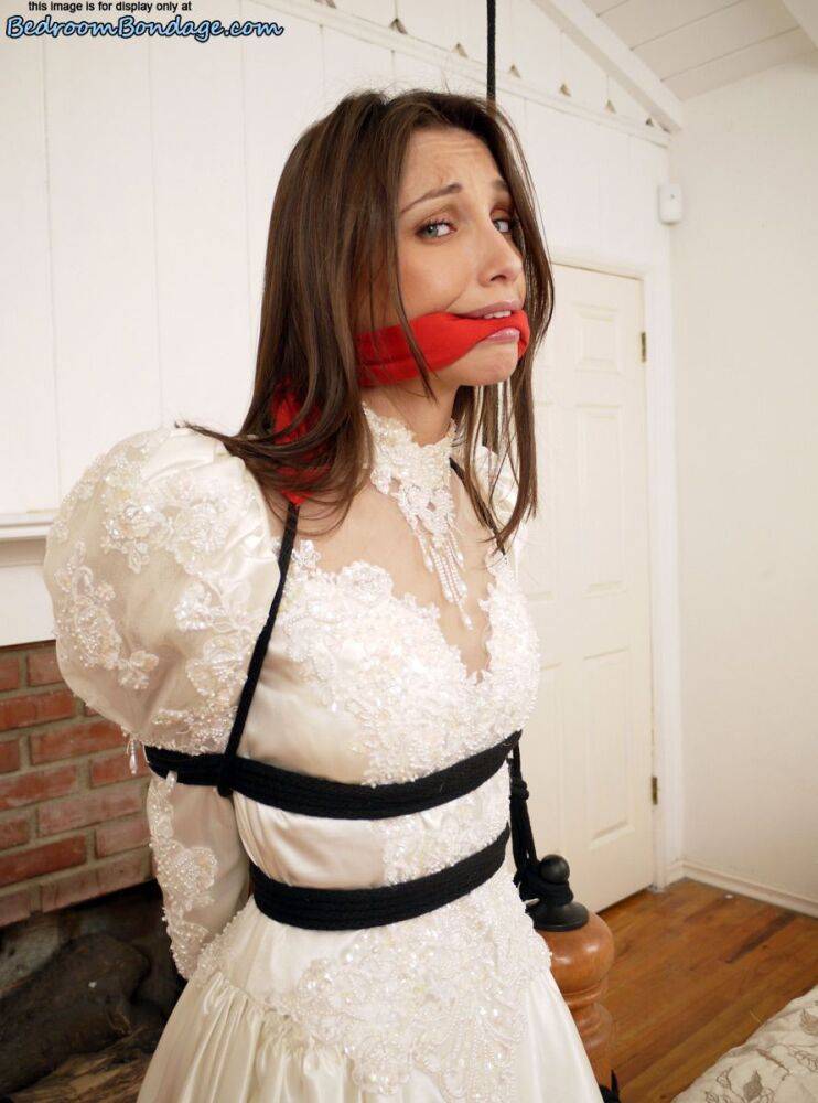 Brunette bride Celeste Star is ballgagged and tied up in her wedding dress - #6