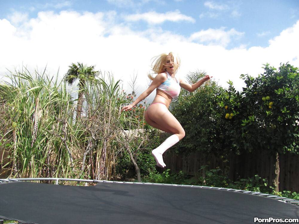 18 year old blonde Halie Cummings baring big boobs on trampoline outdoors - #9