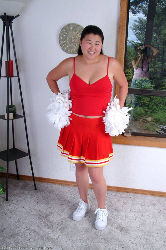 Chubby Asian first timer baring small boobs while shedding cheer uniform - #1