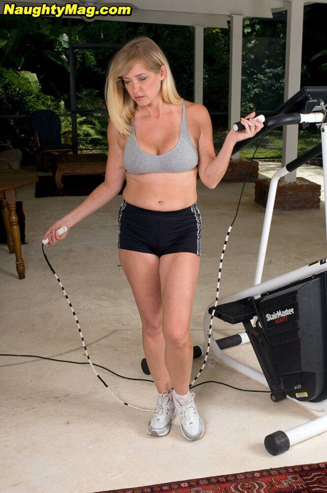 Busty blonde MILF exposes her big natural tits while working out at the gym - #5