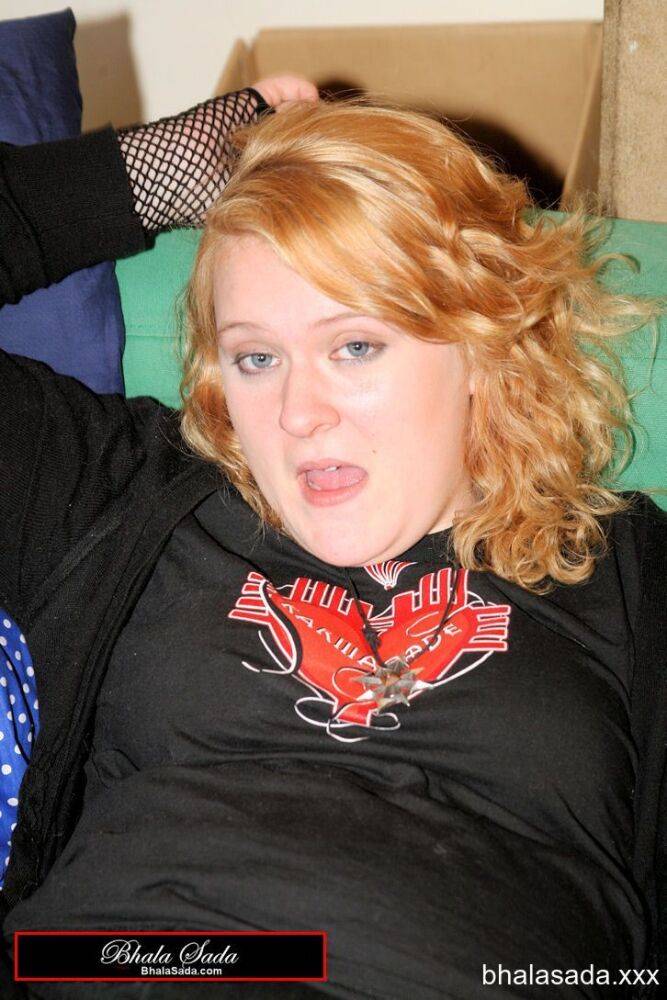 Redheaded fatty strips her sweatshirt and shows her cleavage in a black bra - #13
