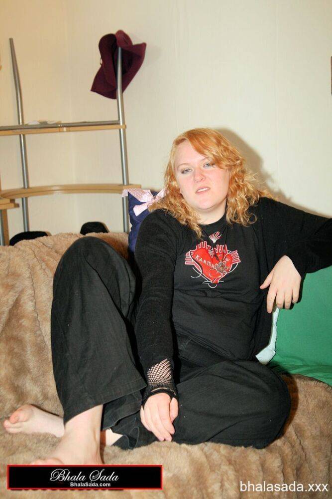 Redheaded fatty strips her sweatshirt and shows her cleavage in a black bra - #5