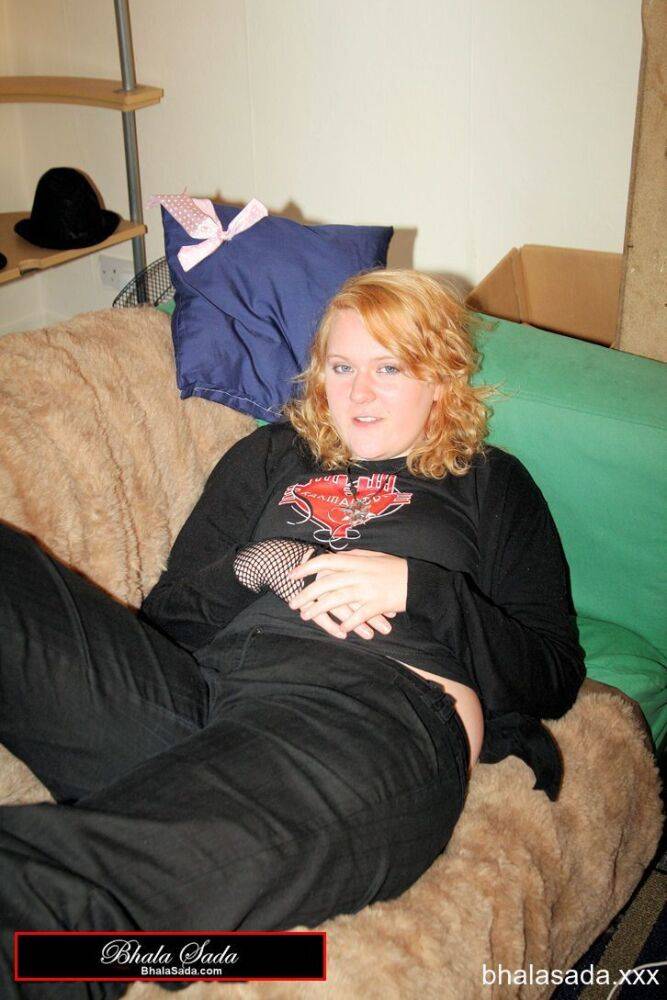 Redheaded fatty strips her sweatshirt and shows her cleavage in a black bra - #12
