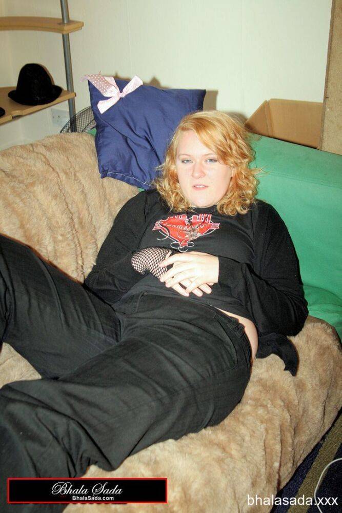 Redheaded fatty strips her sweatshirt and shows her cleavage in a black bra - #11