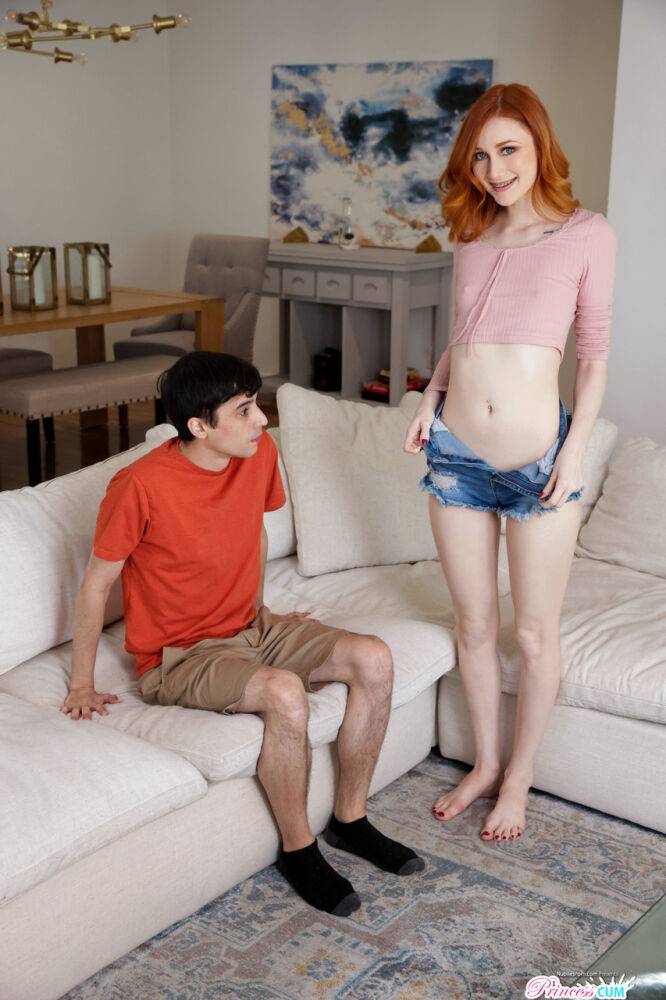 Redheaded vixen Scarlet Skies screws her young stepbrother on the sofa - #4