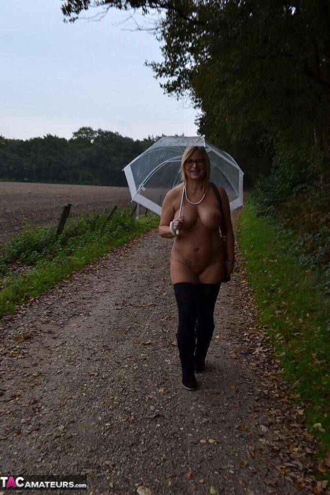 Big titted mature Chrissy in glasses walks naked in the rain showing fat ass - #8