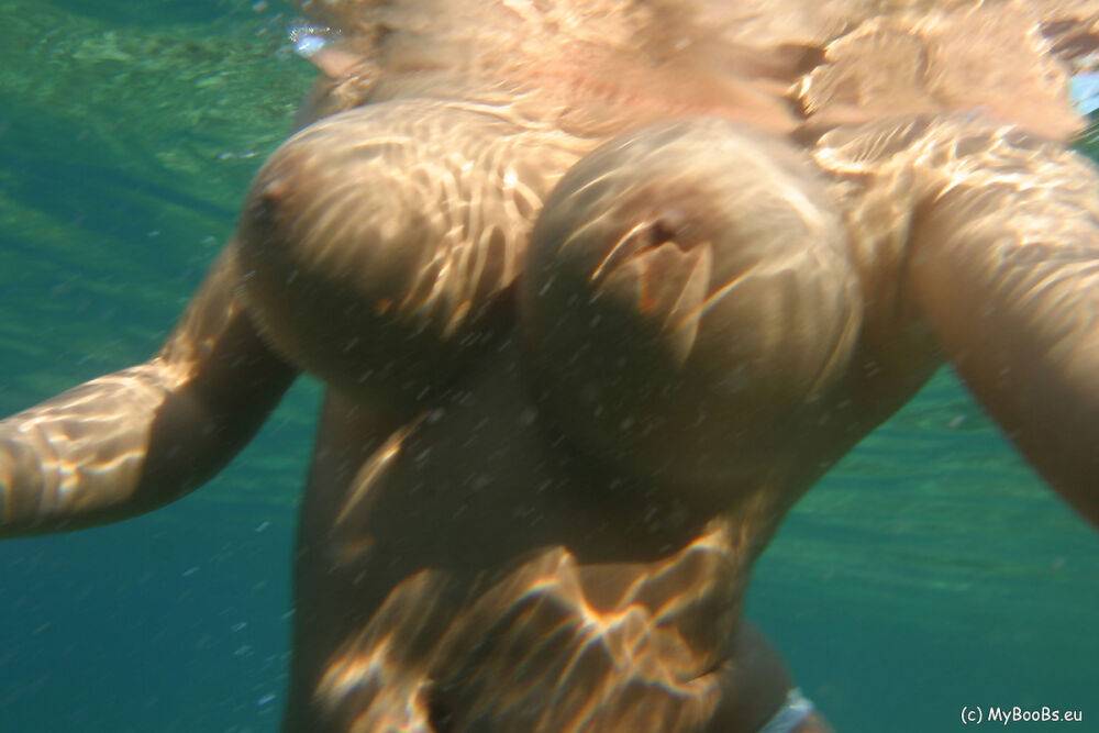 Big boobed lesbians Aneta Buena and Kora Kryk go for a topless swim - #15