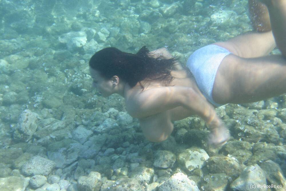 Big boobed lesbians Aneta Buena and Kora Kryk go for a topless swim - #10